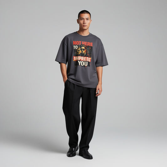 Male model wearing “Not Here to Impress You” statement streetwear t-shirt, front view, urban minimal style