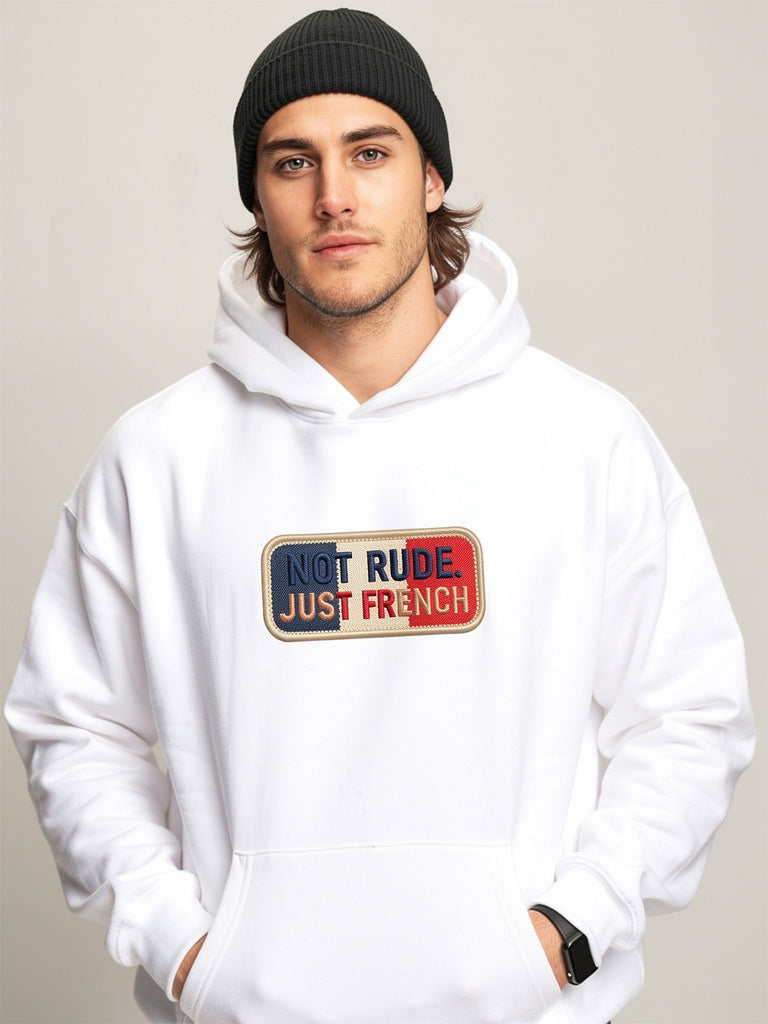 Model wearing white oversized hoodie with “Not Rude Just French” statement patch