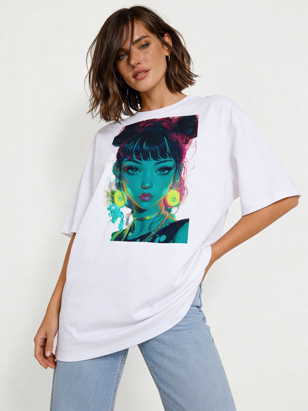 Woman modeling oversized white streetwear graphic tee with colorful neon illustrated girl portrait in teal and pink tones, relaxed urban fashion look