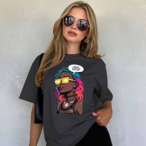 Model wearing anthracite unisex graphic t-shirt with colorful comic-style portrait design in a studio setting