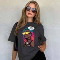 Model wearing anthracite unisex graphic t-shirt with colorful comic-style portrait design in a studio setting