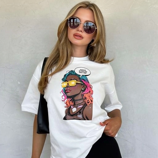 Model wearing white unisex graphic t-shirt with colorful comic-style portrait design in a studio setting