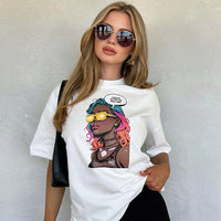 Model wearing white unisex graphic t-shirt with colorful comic-style portrait design in a studio setting