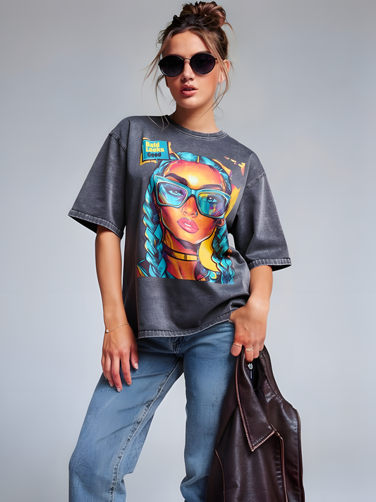 Model wearing unisex denim graphic t-shirt with colorful pop art portrait design in a studio setting