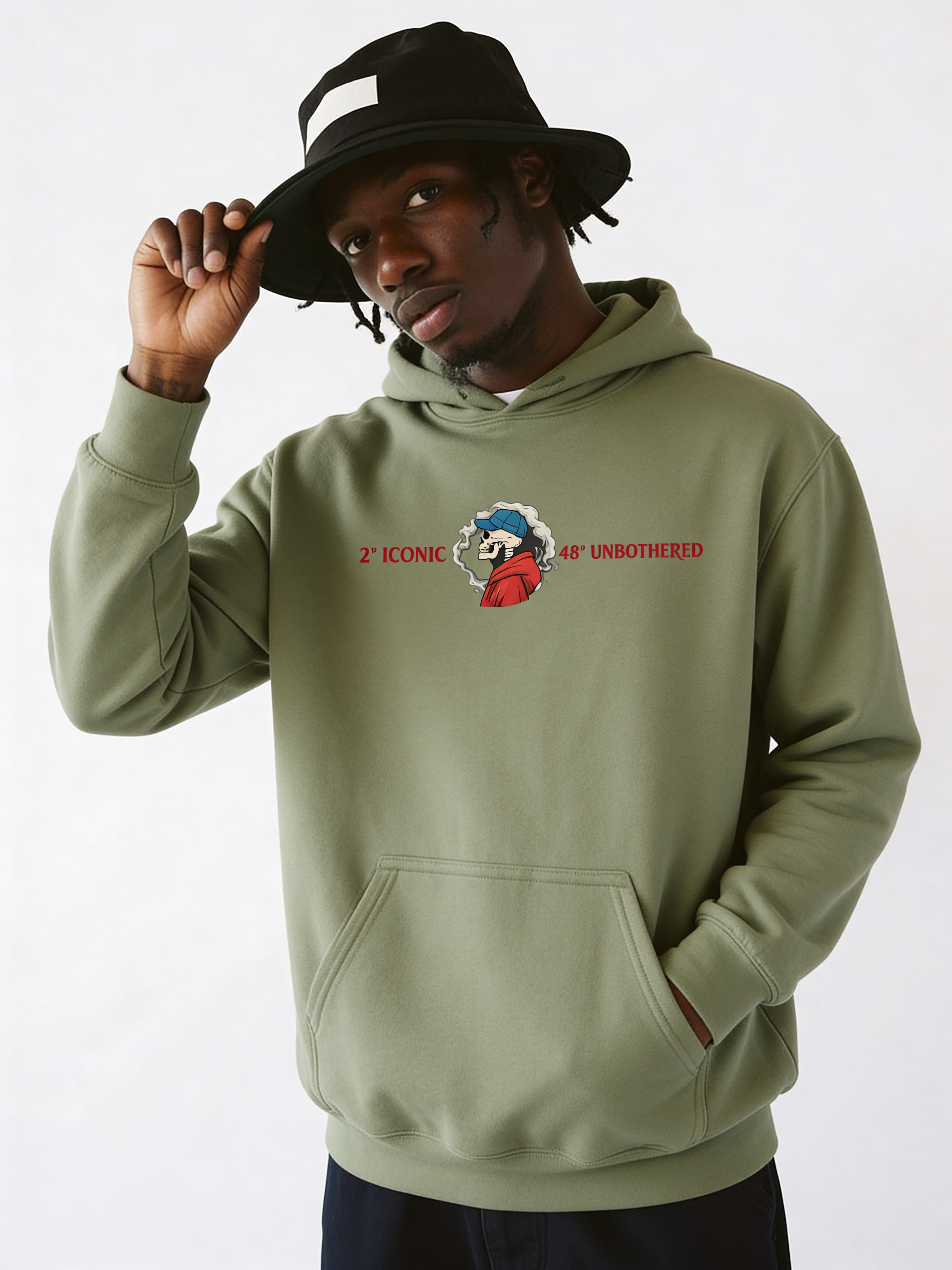 Male model in olive green oversized hoodie featuring small chest logo graphic, modern casual streetwear outfit