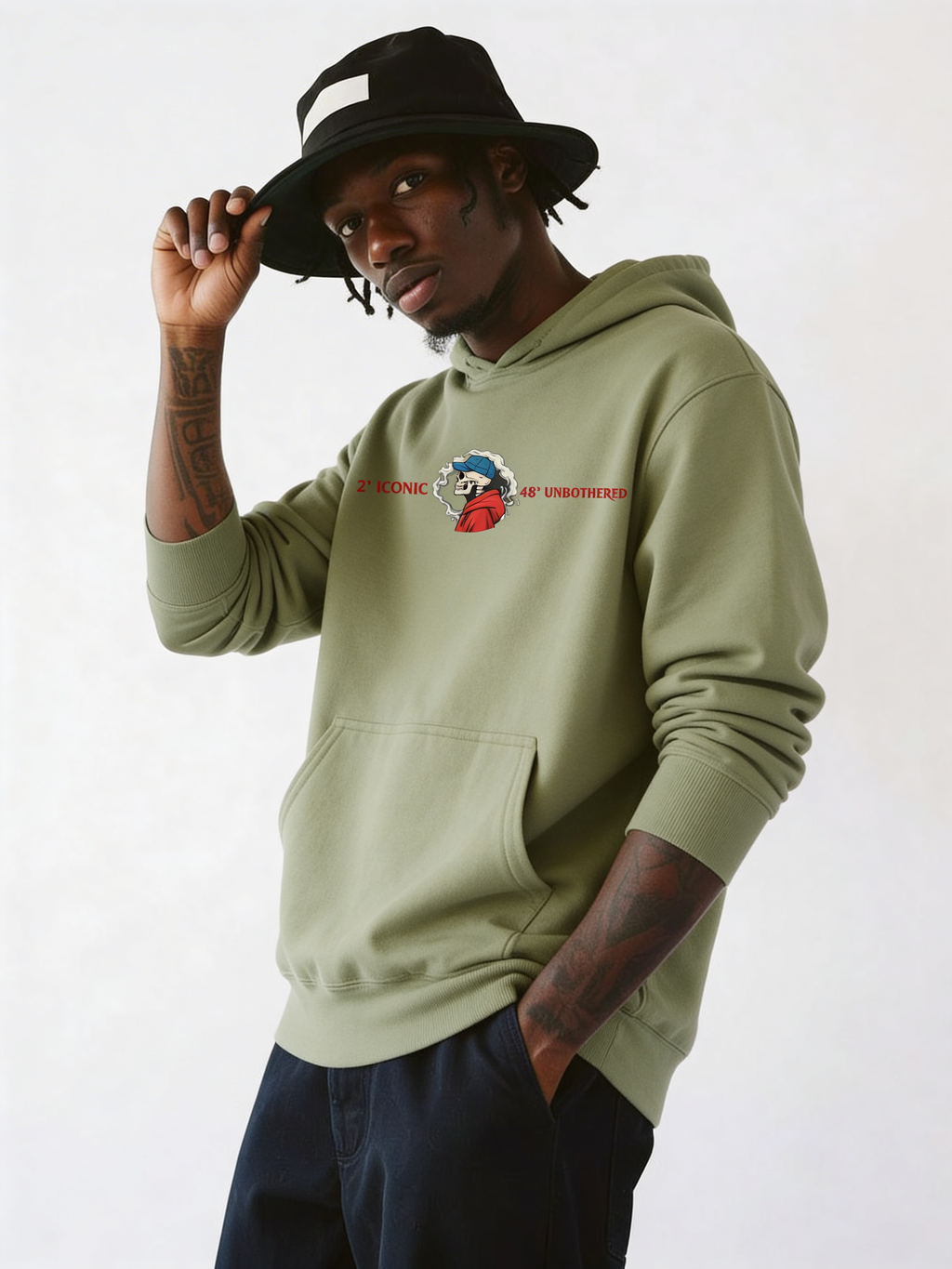 Male model in olive green oversized hoodie featuring small chest logo graphic, modern casual streetwear outfit