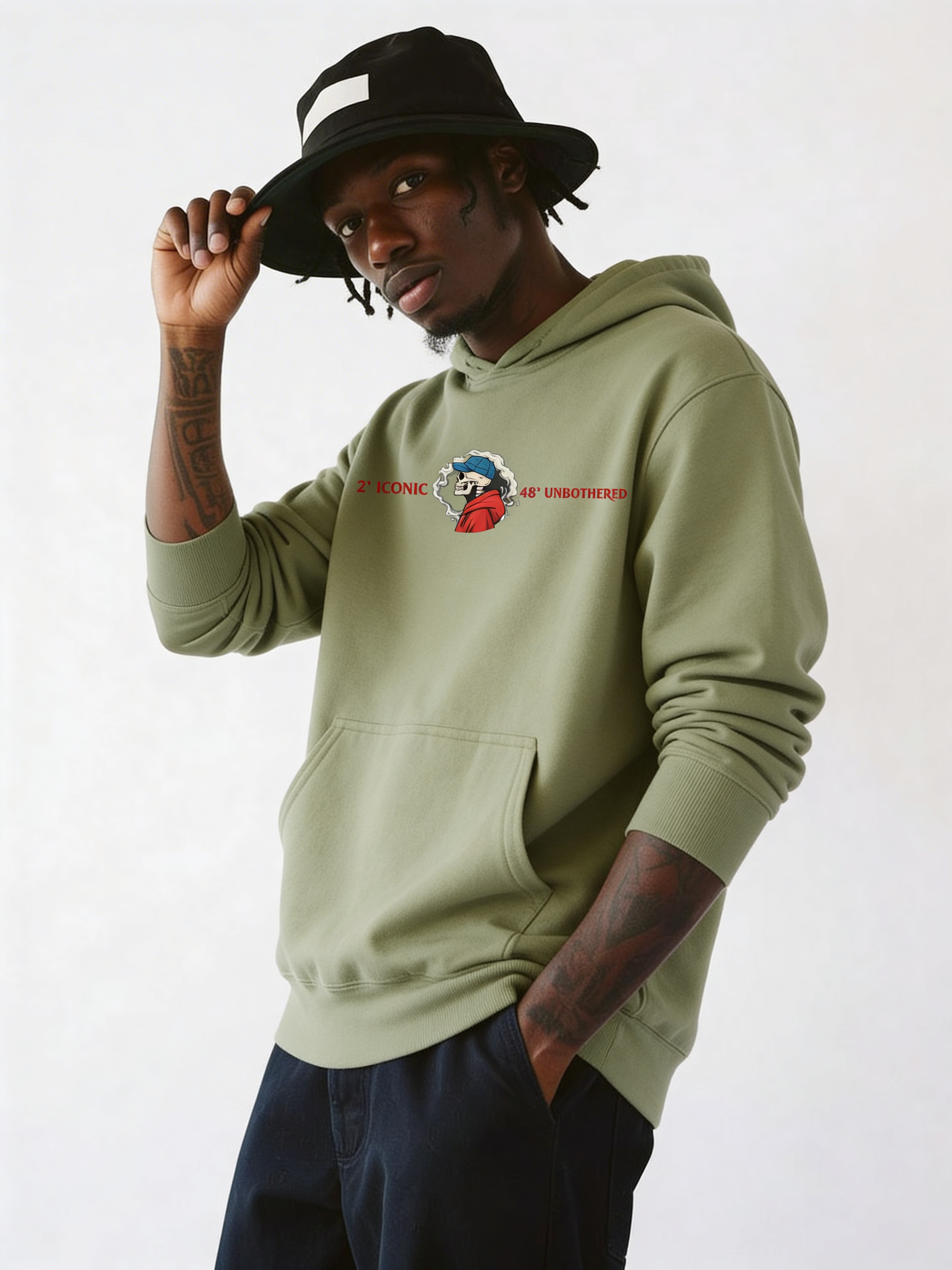 Male model in olive green oversized hoodie featuring small chest logo graphic, modern casual streetwear outfit