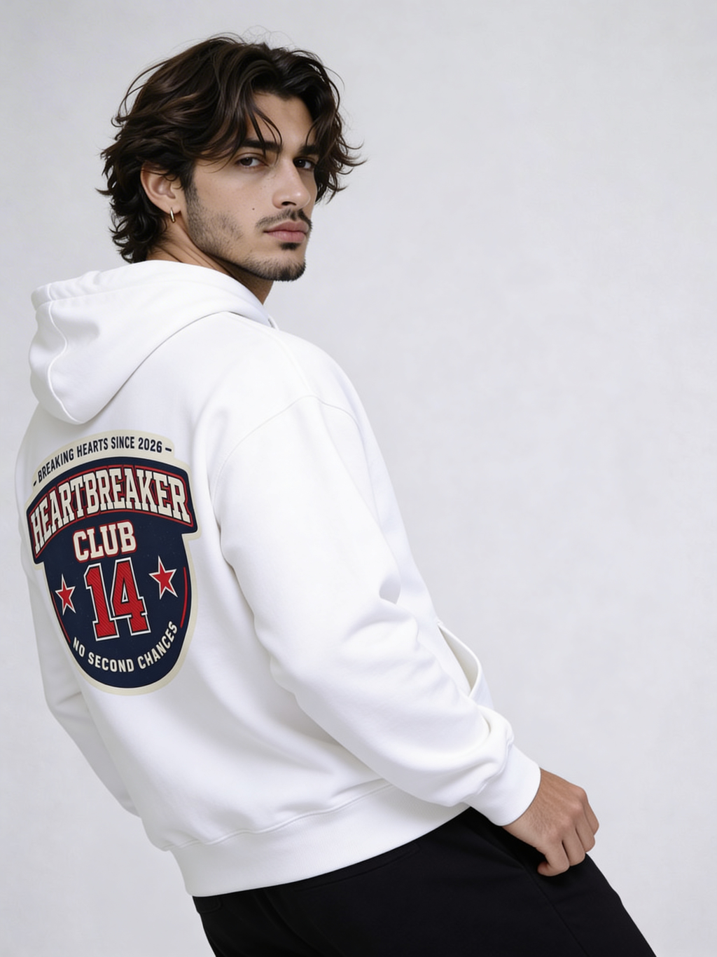 Noiré white oversized hoodie back view with large “Heartbreaker Club 14 – No Second Chances” varsity graphic, worn by male model, streetwear statement hoodie.