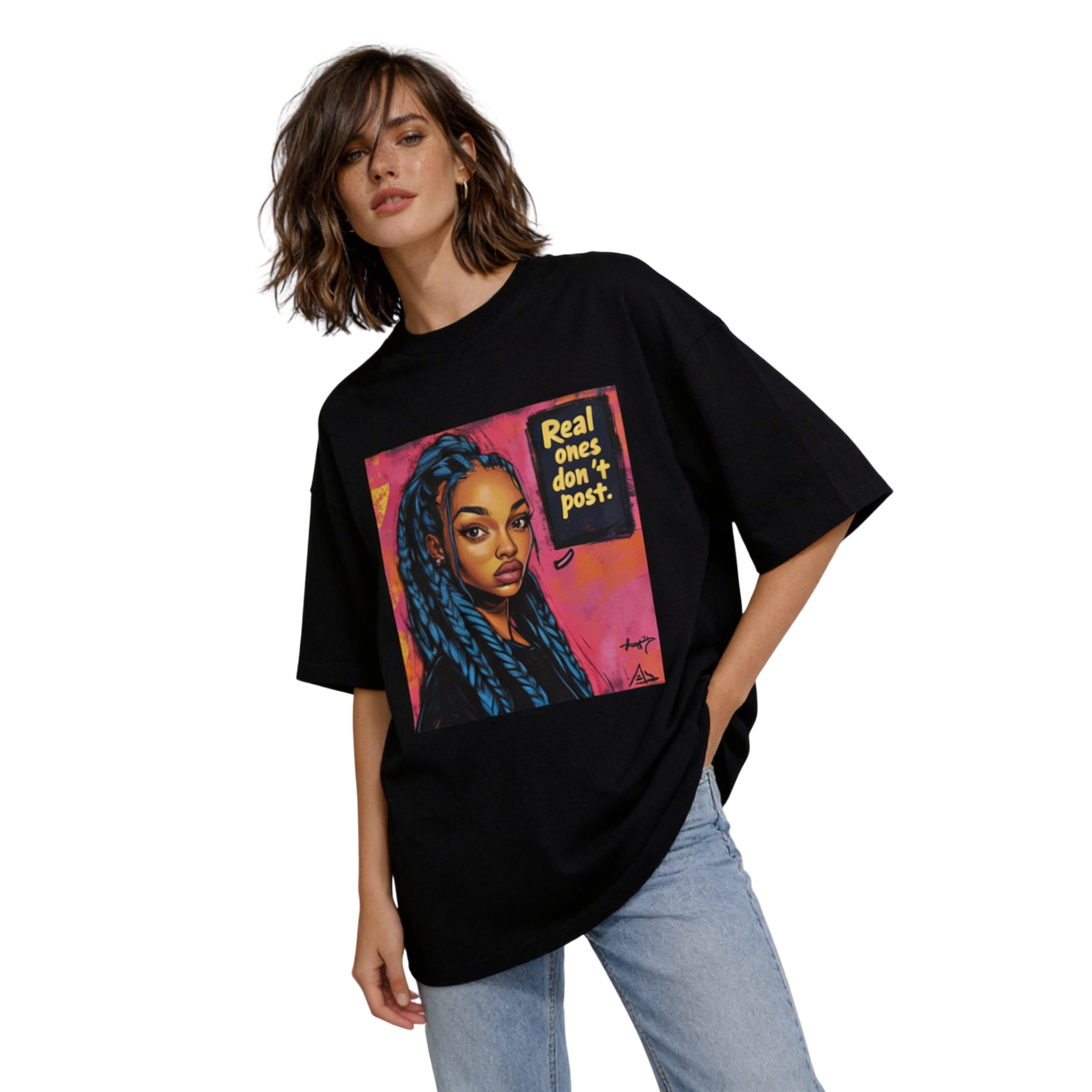 Female model wearing oversized black streetwear T-shirt with “Real ones don’t post” graphic portrait print, paired with light blue jeans.