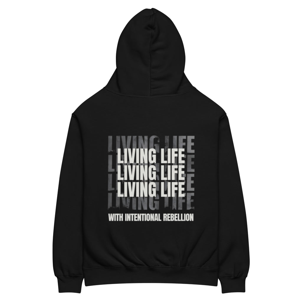Black oversized hoodie featuring repeated “Living Life” typography and the phrase “Living life with intentional rebellion” printed on the back.