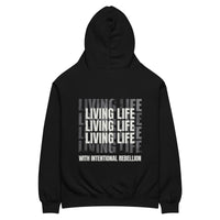 Black oversized hoodie featuring repeated “Living Life” typography and the phrase “Living life with intentional rebellion” printed on the back.
