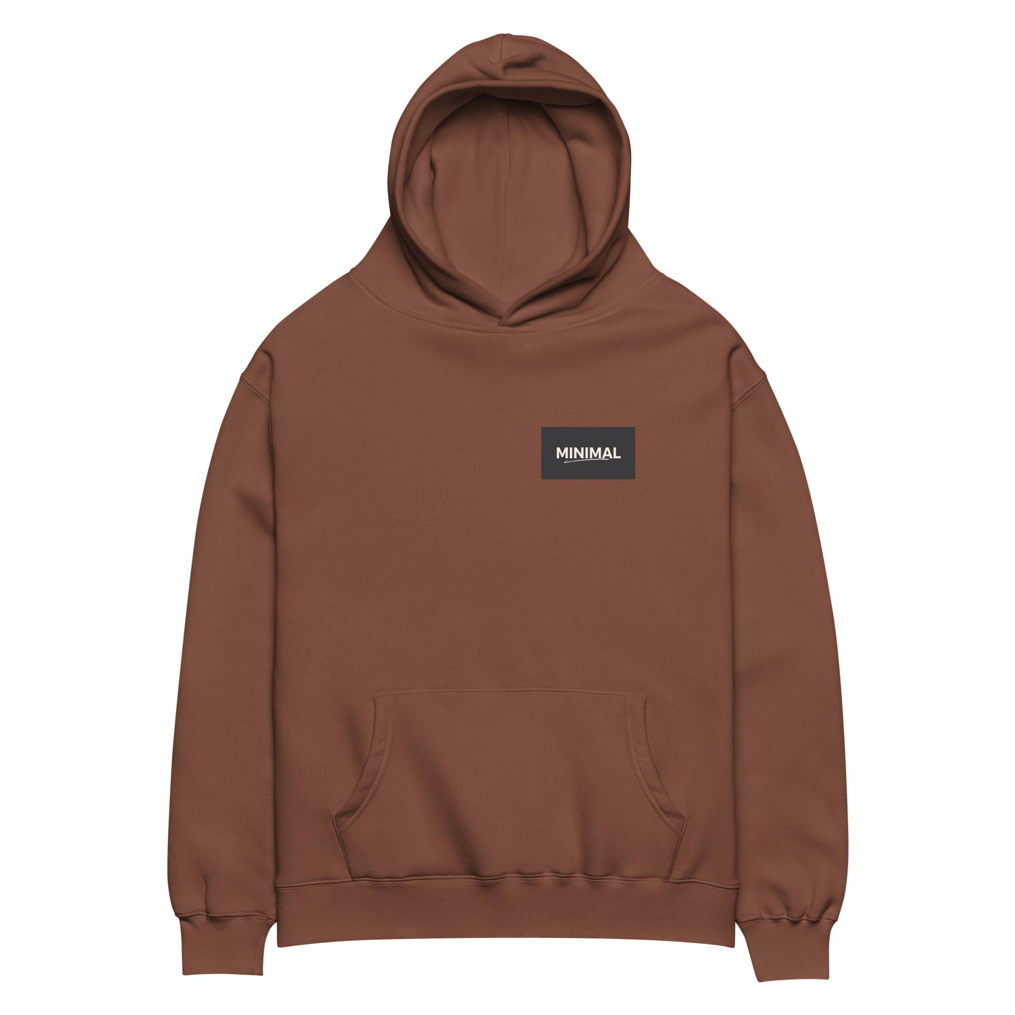 Oversized hoodie in brown with "Minimal But Never Basic" statement typography, front view