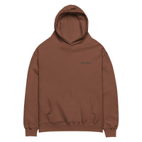 Chestnut oversized unisex hoodie with minimalist front design, featuring subtle “EST. 2025” text on the chest, clean streetwear style and relaxed fit.