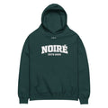 Dark green oversized hoodie with Noiré logo typography design, front view