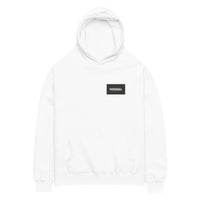 Oversized hoodie in white with "Minimal But Never Basic" statement typography, front view