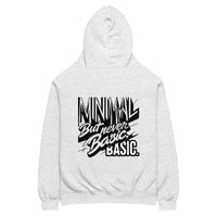 Oversized hoodie in light grey with "Minimal But Never Basic" statement typography, back view