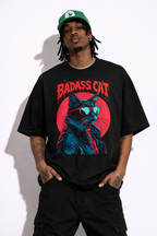 Male model wearing oversized black urban graphic t-shirt with badass cat illustration streetwear design