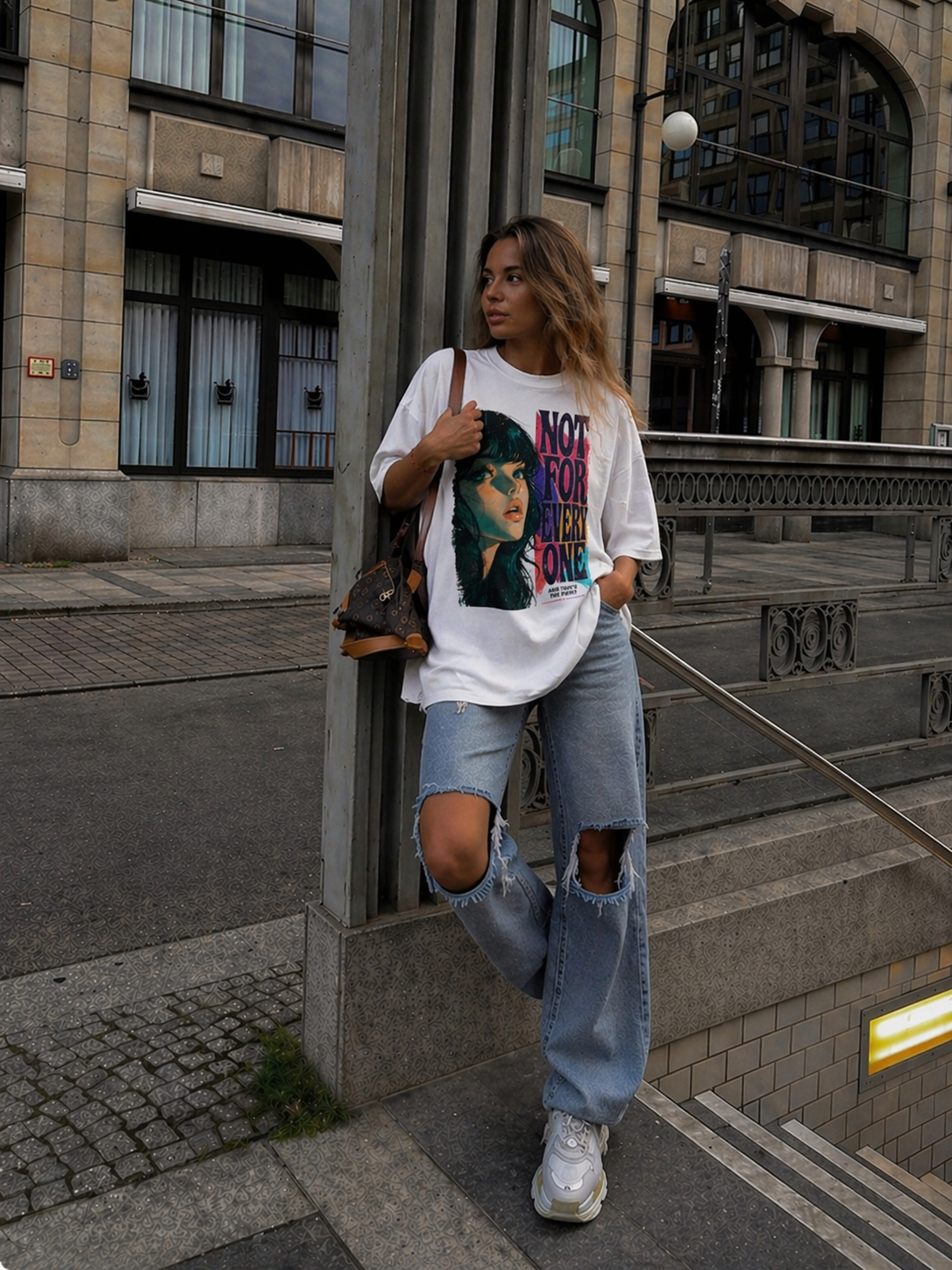 model casual stance wearing oversized white graphic t-shirt not for everyone design urban streetwear outfit