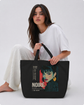 model seated front view wearing oversized black tote bag anime noiré design urban streetwear outfit