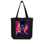 Black canvas tote bag with colorful female portrait graphic and “Turn It Up” text, unisex streetwear tote bag front view.