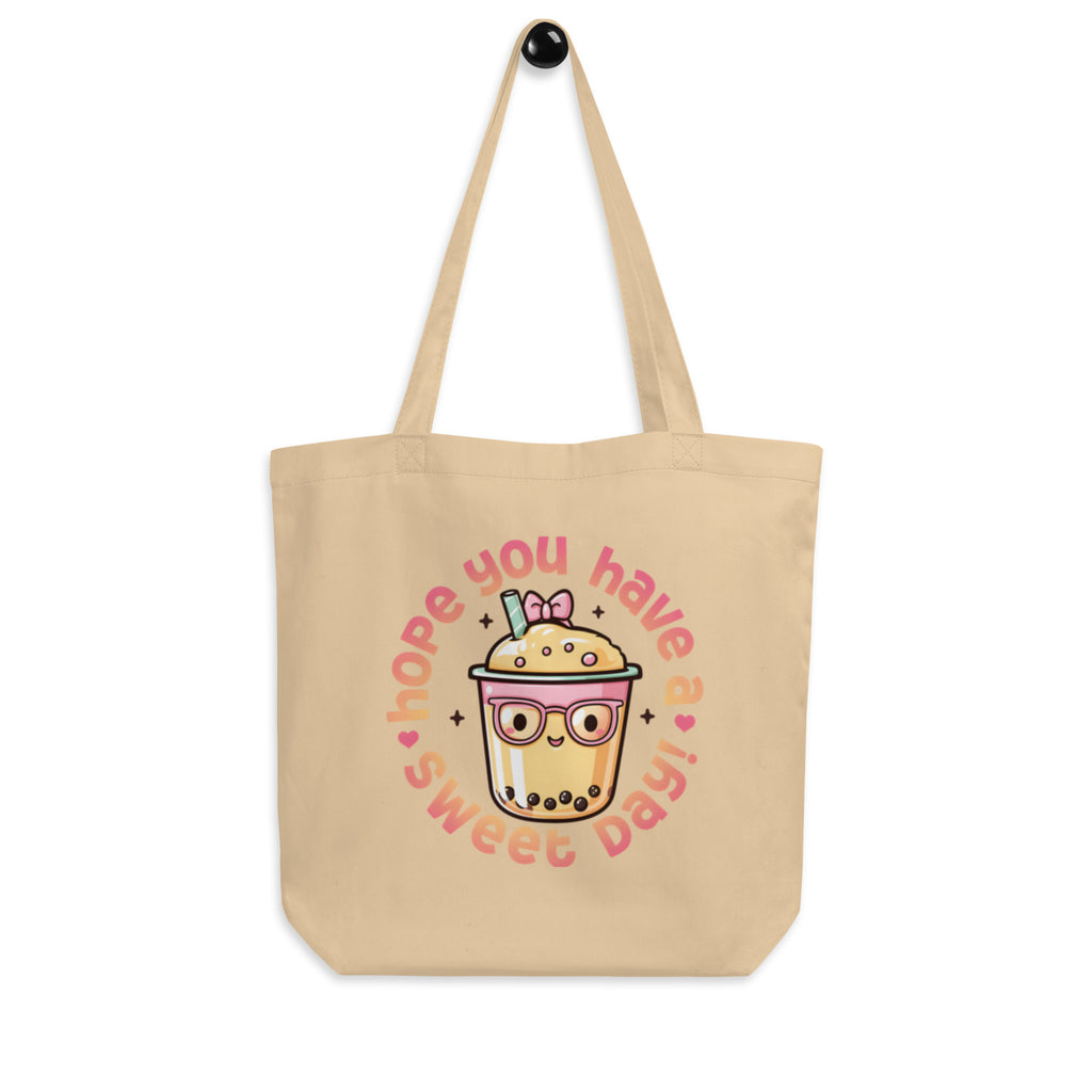 front view hanging beige canvas tote bag cute bubble tea design minimal studio background streetwear fashion
