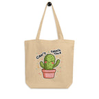 Natural canvas Nöiré cactus graphic tote bag, hanging product view