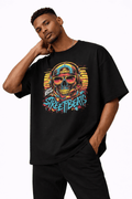 male model portrait pose wearing oversized black graphic t shirt neon skull street art design urban streetwear outfit