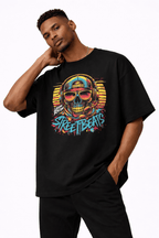 male model portrait pose wearing oversized black graphic t shirt neon skull street art design urban streetwear outfit