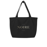 Noiré logo statement canvas tote bag black studio back view