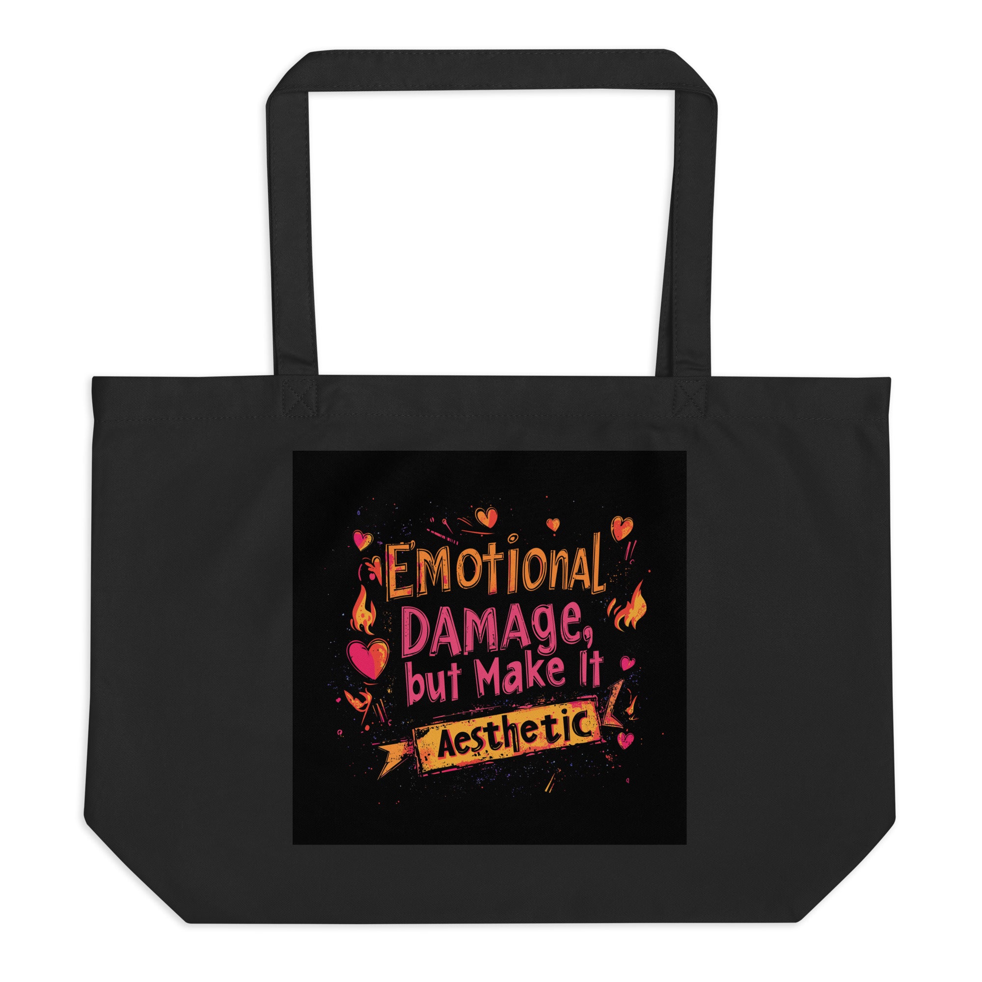 Black canvas tote bag with “Emotional Damage, But Make It Aesthetic” graphic print, unisex streetwear tote bag front view.