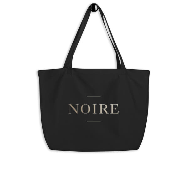 Canvas tote bag Noiré logo statement black flat lay front view
