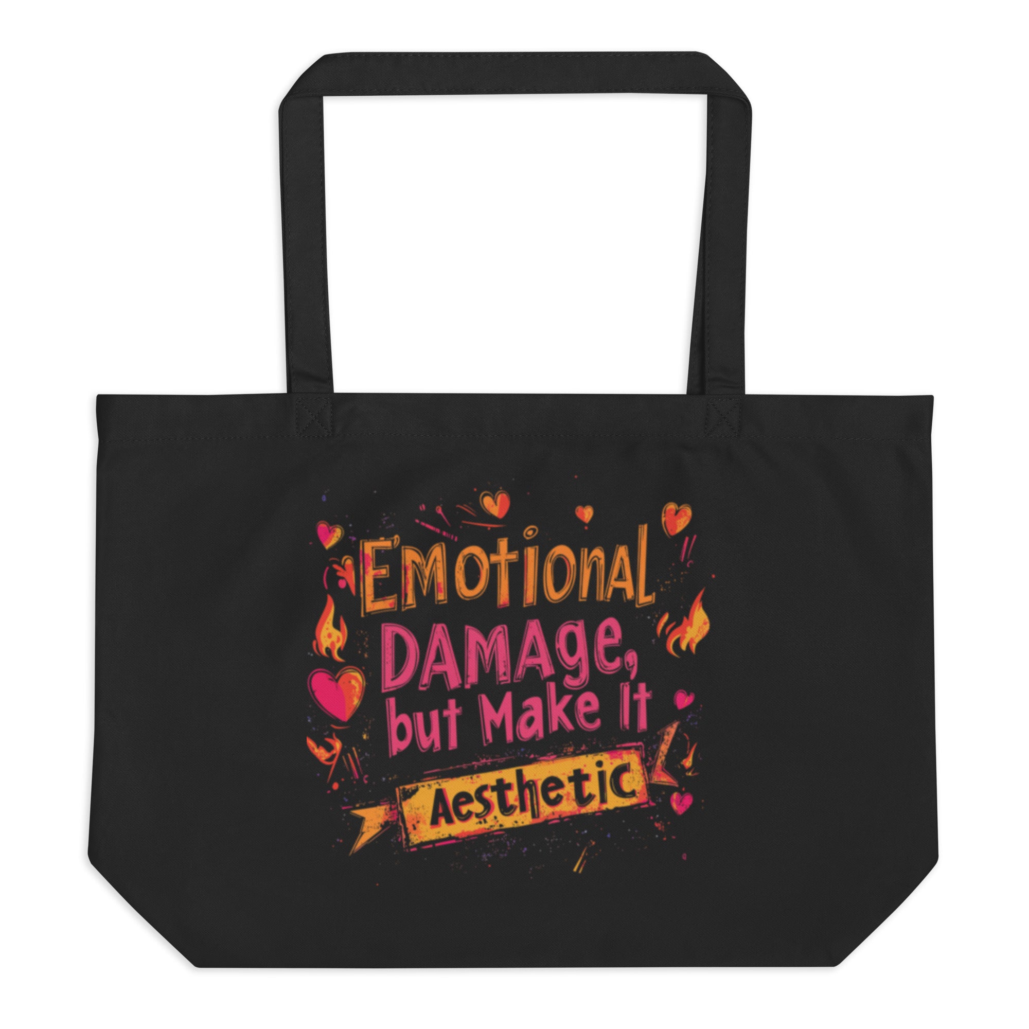 Black canvas tote bag with “Emotional Damage, But Make It Aesthetic” graphic print, unisex streetwear tote bag front view.