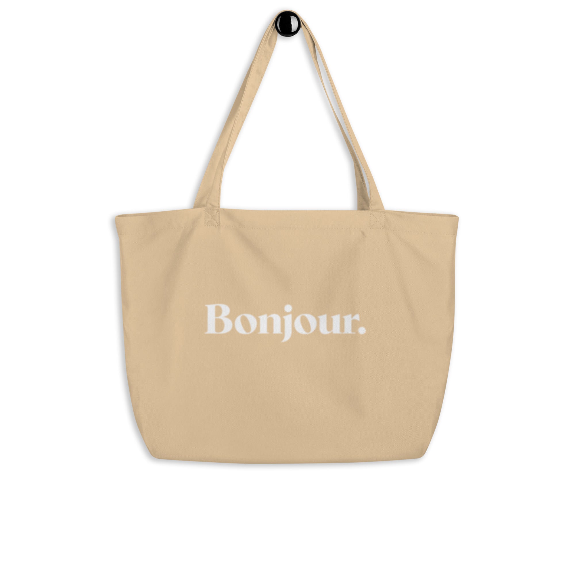 product hanging beige tote bag bonjour typography design streetwear fashion