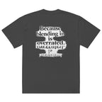 streetwear graphic t-shirt back view with “Because blending in is overrated” statement typography print
