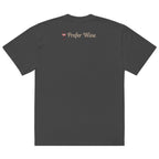 Back view of faded black t-shirt with small “Prefer Wine” text and wine glass icon printed on upper back near neckline in soft blush tones