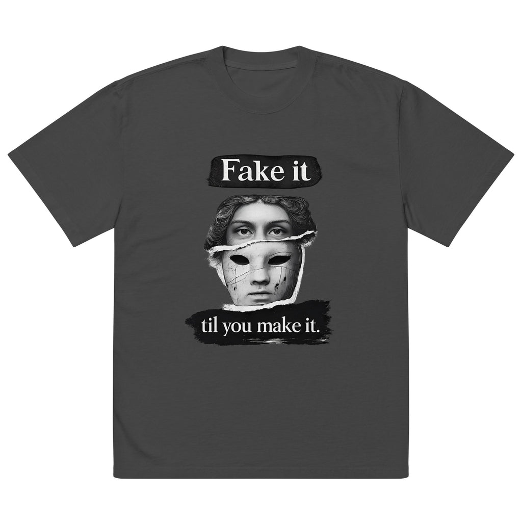 Black unisex t-shirt front view with illustrated face graphic and “Fake it til you make it” slogan, modern streetwear tee