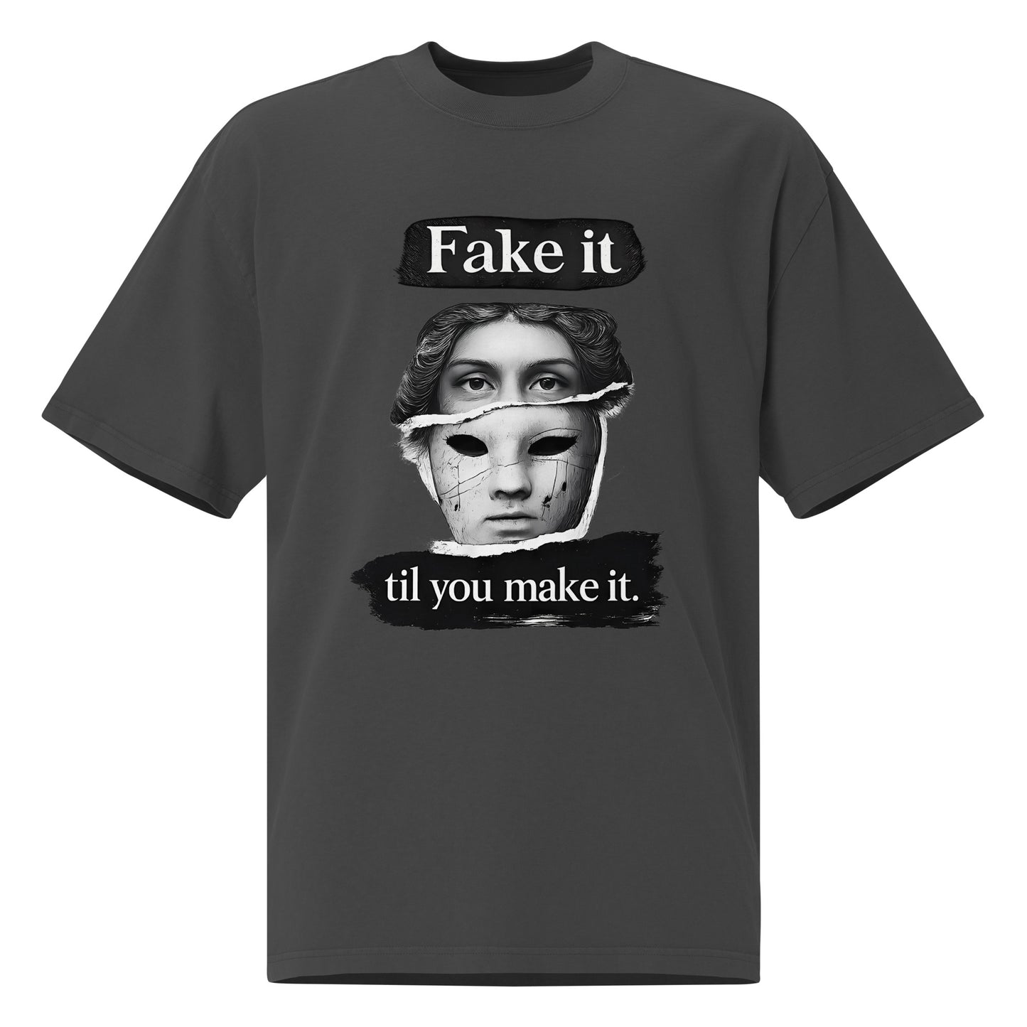 Faded Black unisex t-shirt front view with illustrated face graphic and “Fake it til you make it” slogan, modern streetwear tee