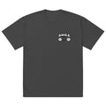 black t-shirt with small “SMILE” logo and minimalist smiley icons on the left chest, modern streetwear design by Noiré.