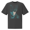 Oversized dark gray graphic t-shirt featuring moody teal portrait artwork of a man in sunglasses with cinematic lighting.
