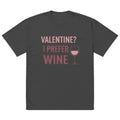 Front view of dark charcoal t-shirt with pink “Valentine? I Prefer Wine” typography and wine glass icon graphic printed on chest.