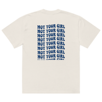 Oversized faded bone unisex t-shirt back view with repeated “Not Your Girl” blue typography print
