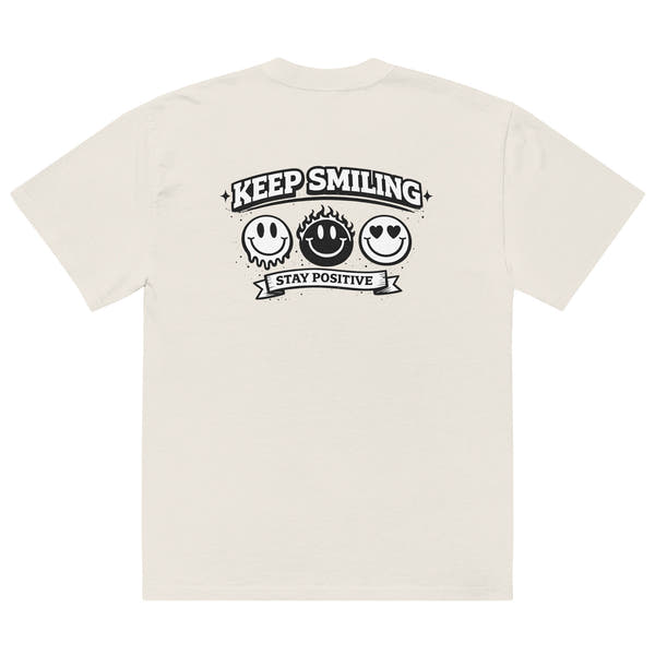 beige t-shirt back view featuring large “KEEP SMILING – STAY POSITIVE” graphic with three vintage-style smiley faces in black, urban graphic design by Noiré.