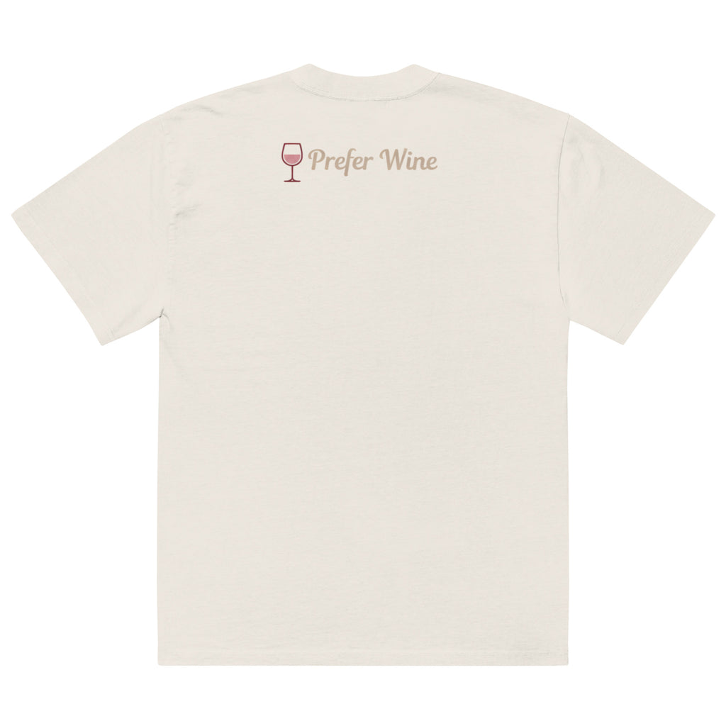 Back view of faded bone t-shirt with small “Prefer Wine” text and wine glass icon printed on upper back near neckline in soft blush tones