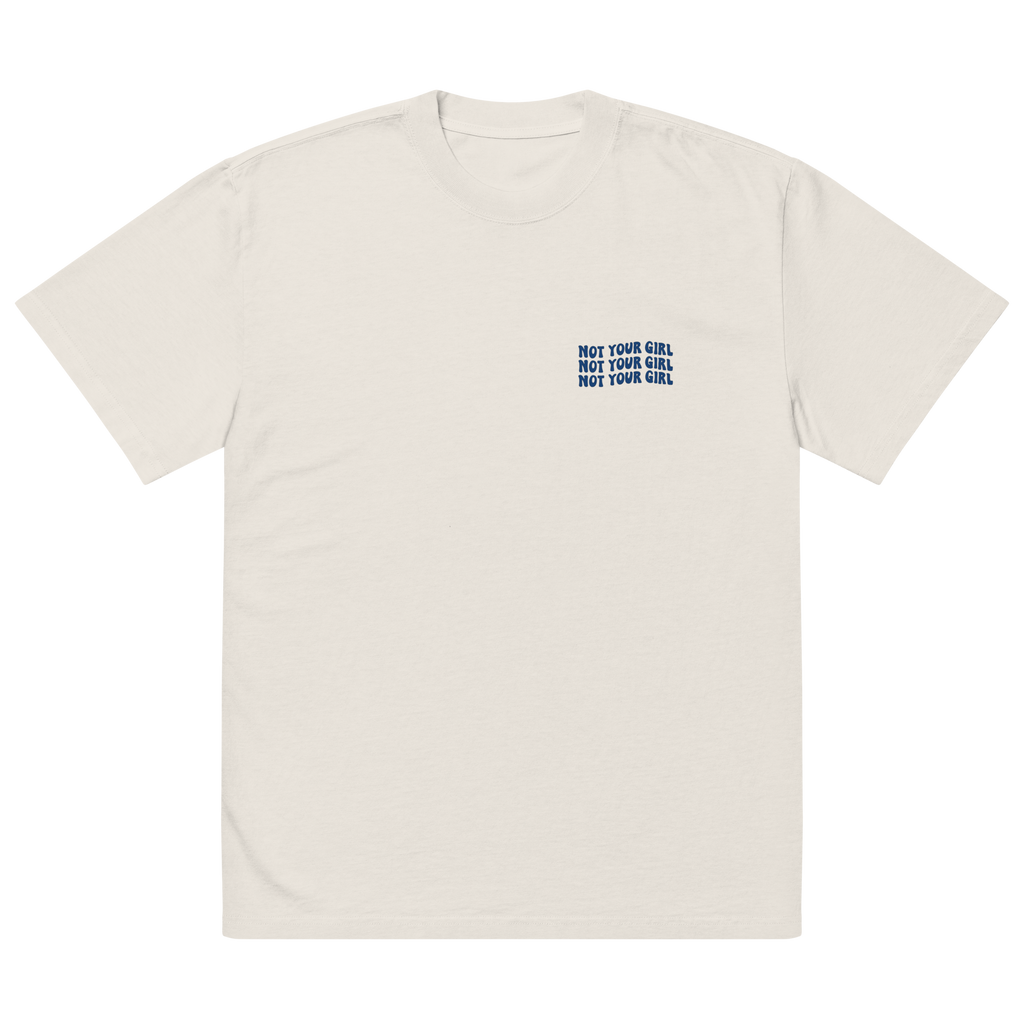 Oversize faded bone unisex t-shirt front view with small “Not Your Girl” blue logo print on chest
