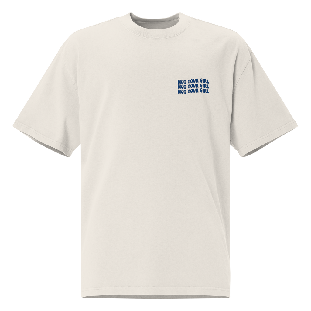 Oversize faded bone unisex t-shirt front view with small “Not Your Girl” blue logo print on chest