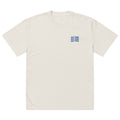 Front view of cream oversized women’s t-shirt with small navy “Just Mine” chest print, modern minimalist streetwear style.
