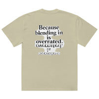 streetwear graphic t-shirt back view with “Because blending in is overrated” statement typography print
