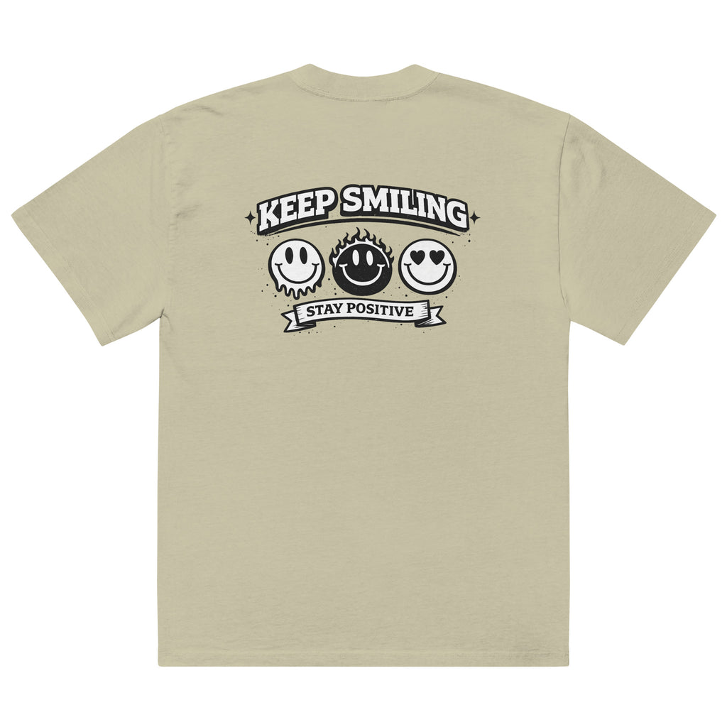 eucalyptus t-shirt back view featuring large “KEEP SMILING – STAY POSITIVE” graphic with three vintage-style smiley faces in black, urban graphic design by Noiré.