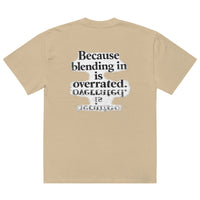 streetwear graphic t-shirt back view with “Because blending in is overrated” statement typography print
