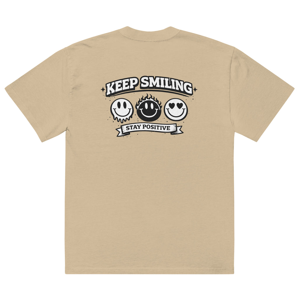  khaki t-shirt back view featuring large “KEEP SMILING – STAY POSITIVE” graphic with three vintage-style smiley faces in black, urban graphic design by Noiré.